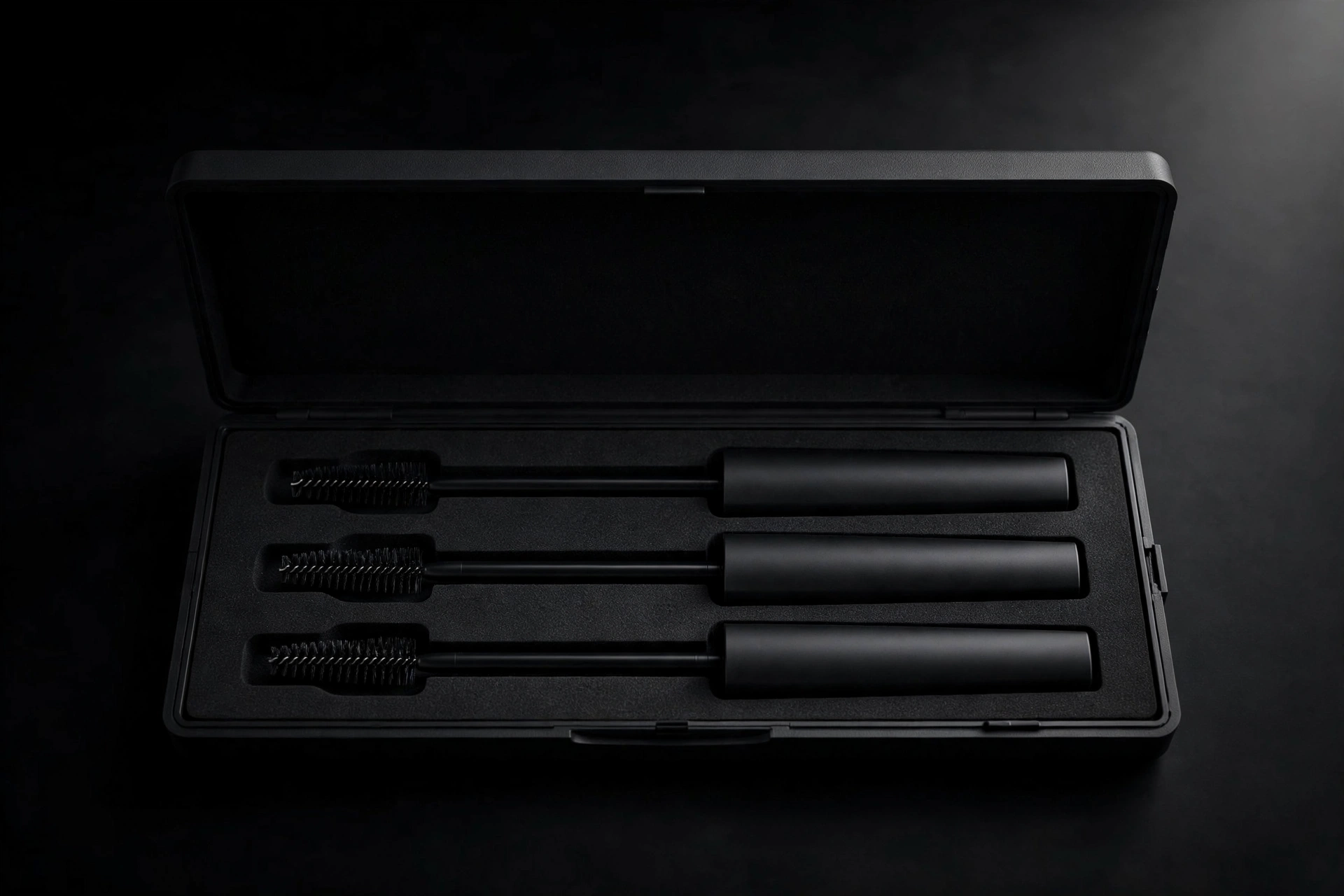 Slim matte-black EVA tube case with three mascara wands
