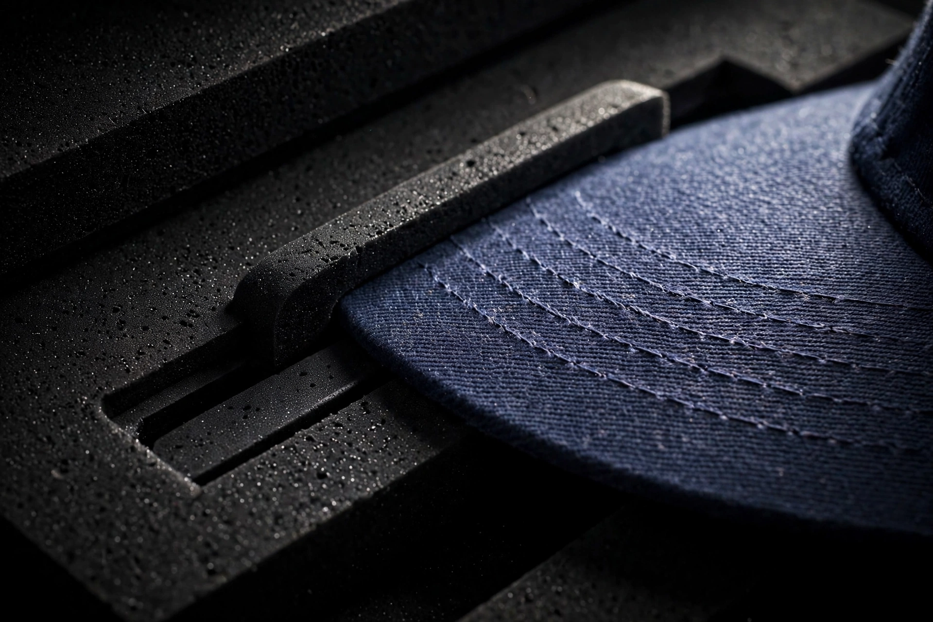 Cap brim sliding into the dedicated flat brim slot inside the EVA cap carrier