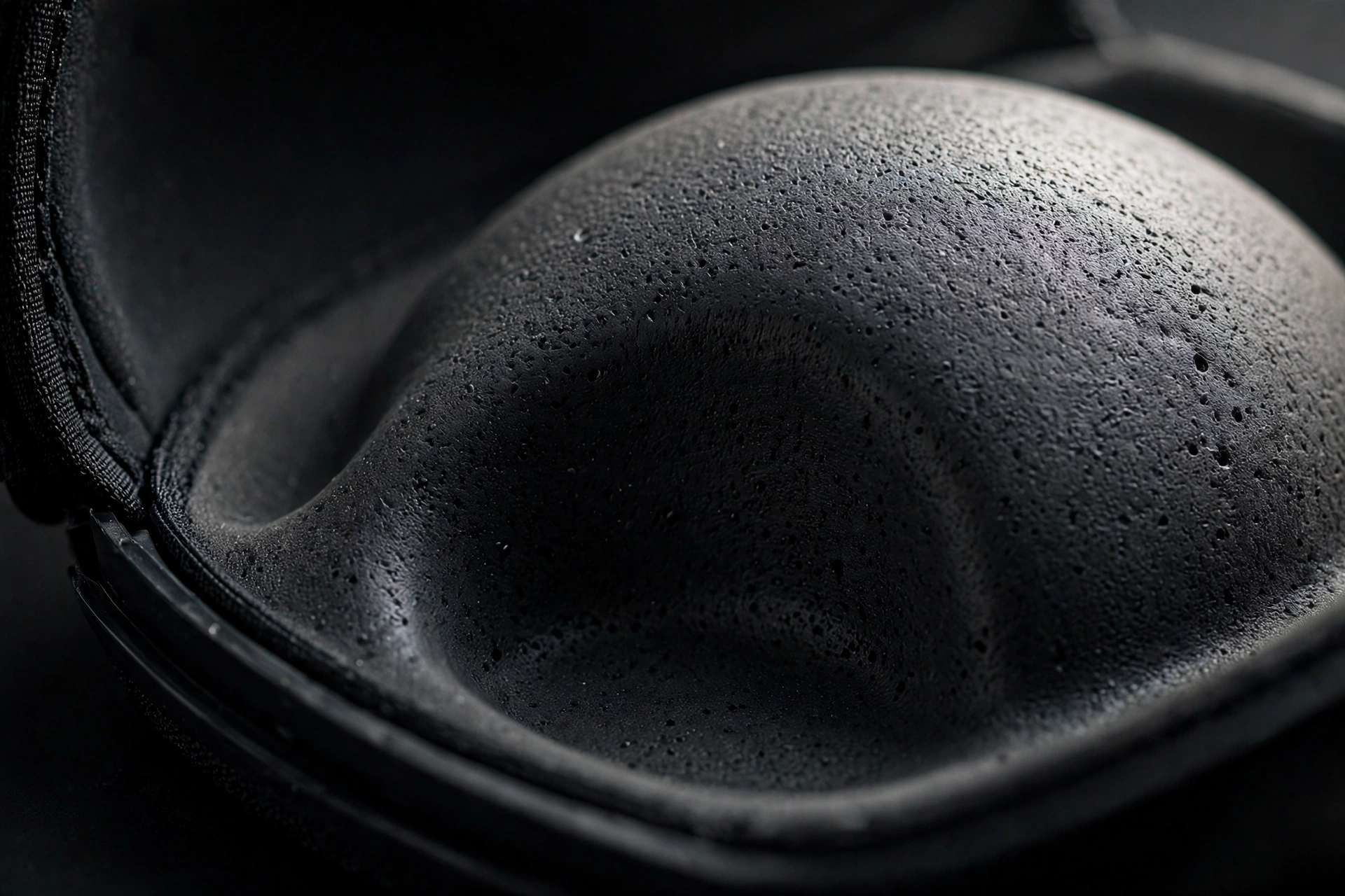 Molded EVA dome cradle inside the cap carrier showing the smooth crush-proof curved surface