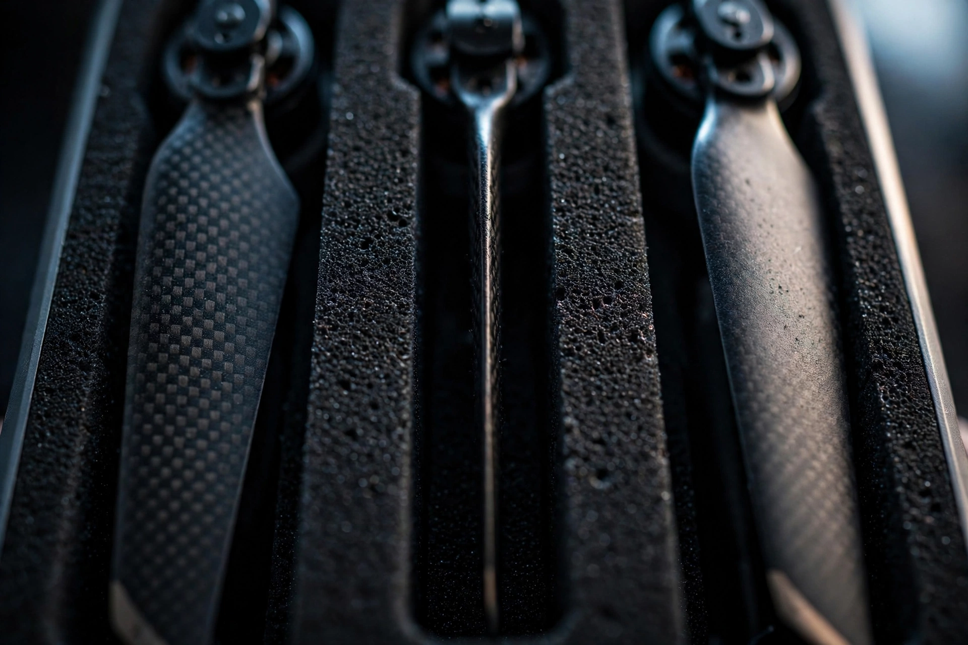 Spare drone propellers slotted vertically into narrow die-cut EVA slots